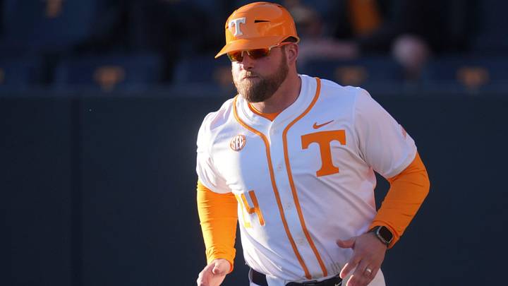 Tennessee baseball coach Josh Elander runs out to his spot at third base during the NCAA college baseball game against Nicholls on Feb. 13, 2026, in Knoxville, Tennessee.