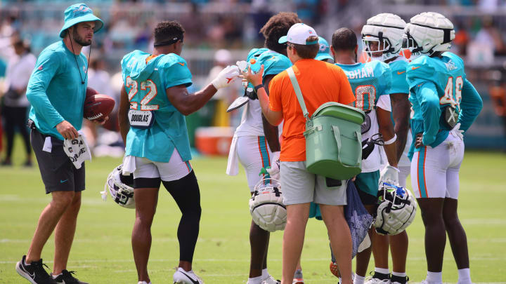 Jul 29, 2024; Miami Gardens, FL, USA; Miami Dolphins safety Elijah Campbell (22) receives a bottle of water during training camp at Baptist Health Training Complex. Mandatory Credit: Sam Navarro-USA TODAY Sports