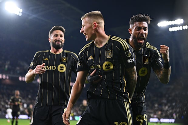 LAFC midfielder Mateusz Bogusz celebrates a goal with forwards Denis Bouanga and forward Olivier Giroud.