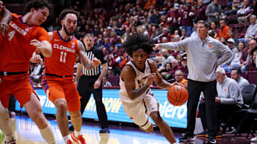 Jan 25, 2025; Blacksburg, Virginia, USA; Virginia Tech Hokies guard Ben Hammond (11) drives to the basket against Clemson Tigers guard Jaeden Zackery (11) during the first half at Cassell Coliseum. Mandatory Credit: Peter Casey-Imagn Images