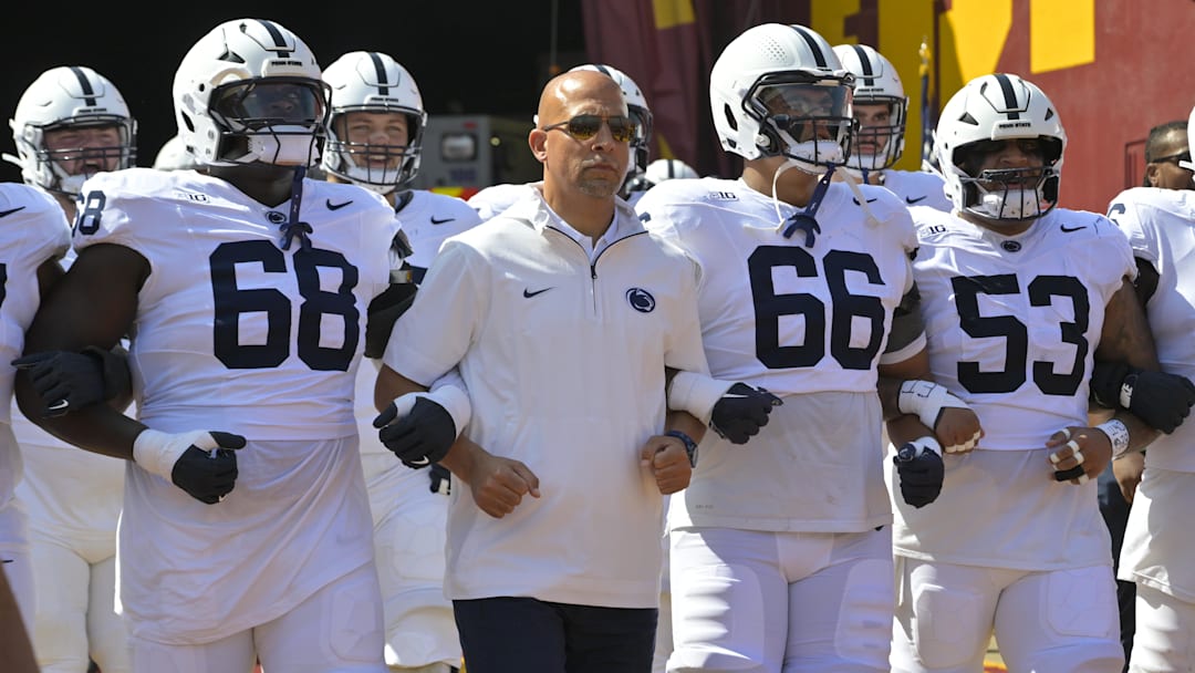 Oct 12, 2024; Los Angeles, California, USA;  Penn State Nittany Lions head coach James Franklin locks arms with players as they head on to United Airlines Field for the game against the USC Trojans at the Los Angeles Memorial Coliseum. Mandatory Credit: Jayne Kamin-Oncea-Imagn Images