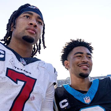 Oct 29, 2023; Charlotte, North Carolina, USA; Houston Texans quarterback C.J. Stroud (7) and Carolina Panthers quarterback Bryce Young (9) after the game at Bank of America Stadium. Mandatory Credit: Bob Donnan-Imagn Images