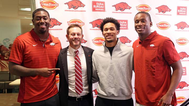 Dec 4, 2025; Fayetteville, AR, USA; Arkansas Razorbacks defensive end Quincy Rhodes Jr, head coach Ryan Silverfield, wide receiver CJ Brown, and quarterback KJ Jackson during the introductory press conference for Silverfield at Frank Broyles Center. Mandatory  Credit: Nelson Chenault-Imagn Images