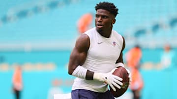 Miami Dolphins wide receiver Tyreek Hill (10) throws the football before preseason game against the Washington Commanders at Hard Rock Stadium.