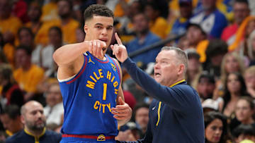 Jun 1, 2023; Denver, CO, USA; Denver Nuggets forward Michael Porter Jr. (1) talks with head coach Michael Malone against the Miami Heat during the third quarter in game one of the 2023 NBA Finals at Ball Arena. Mandatory Credit: Kyle Terada-Imagn Images