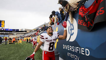 Nov 29, 2025; Morgantown, West Virginia, USA; Texas Tech Red Raiders running back Cameron Dickey (8) celebrates after defeating the West Virginia Mountaineers  at Milan Puskar Stadium. Mandatory Credit: Ben Queen-Imagn Images