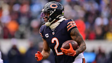 Dec 22, 2024; Chicago, Illinois, USA; Chicago Bears wide receiver DJ Moore (2) runs the ball against the Detroit Lions during the first quarter at Soldier Field. Mandatory Credit: Daniel Bartel-Imagn Images