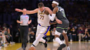 Los Angeles Lakers guard Luka Doncic is fouled by Minnesota Timberwolves forward Jaden McDaniels in the first quarter at Crypto.com Arena in Los Angeles on April 19, 2025.