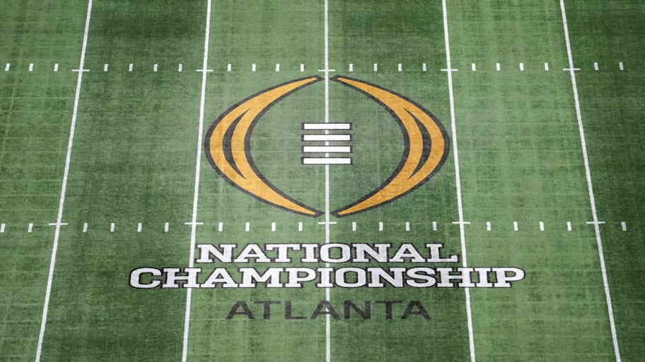 The College Football Playoff National Championship logo at midfield at Mercedes-Benz Stadium. | Kirby Lee-Imagn Images