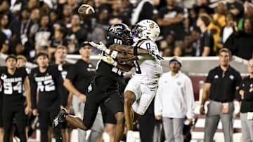 Oct 26, 2024; College Station, Texas, USA; Texas A&M Aggies defensive back Dezz Ricks (10) breaks up a pass intended for LSU Tigers wide receiver Zavion Thomas (0) during the second quarter at Kyle Field. Mandatory Credit: Maria Lysaker-Imagn Images. 
