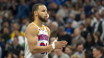 Jan 15, 2025; Minneapolis, Minnesota, USA; Golden State Warriors guard Stephen Curry (30) looks on against the Minnesota Timberwolves in the first half at Target Center.