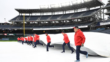 Apr 3, 2024; Washington, District of Columbia, USA; Members of the Washington Nationals ground crew remove a field tarp before a game between the Washington Nationals and the Pittsburgh Pirates at Nationals Park. Mandatory Credit: Rafael Suanes-USA TODAY Sports