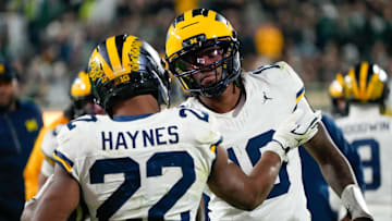 Michigan Wolverines running back Justice Haynes and quarterback Bryce Underwood