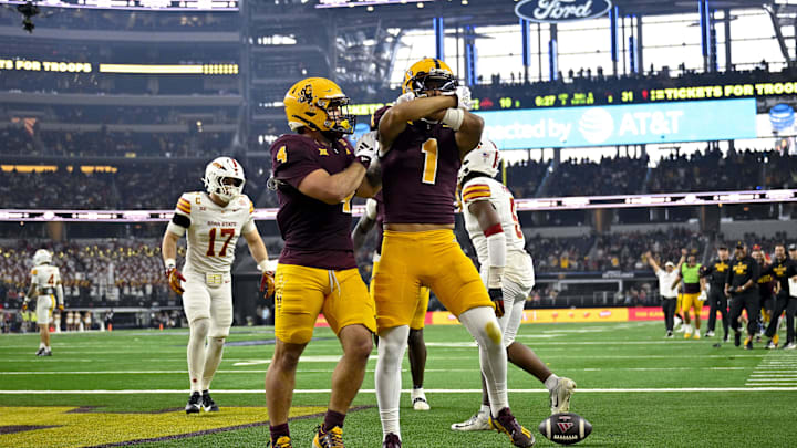 Dec 7, 2024; Arlington, TX, USA; Arizona State Sun Devils wide receiver Xavier Guillory (1) and running back Cam Skattebo (4) celebrate a touchdown against the Iowa State Cyclones during the second half at AT&T Stadium. Mandatory Credit: Jerome Miron-Imagn Images