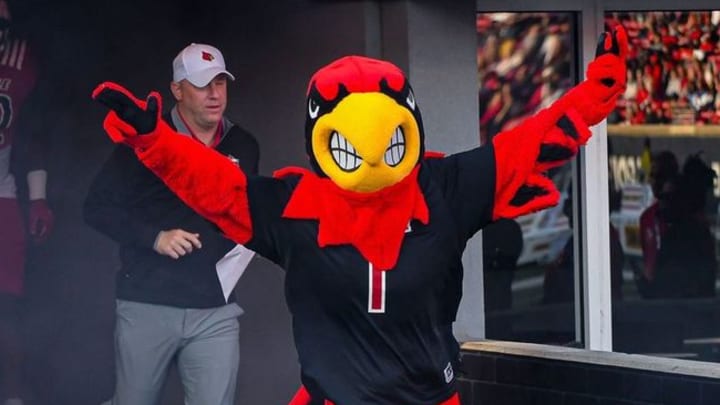 Louisville's mascot and head coach Jeff Brohm