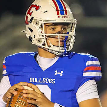 Folsom senior quarterback Ryder Lyons, a four-star BYU commit, helped seal the game late and propel his Bulldogs to their fifth consecutive CIF San-Joaquin Section Division I championship with a dramatic 21-14 victory over Oak Ridge on Friday, Nov. 28, 2025.