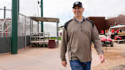 Reds president of baseball operations Nick Krall walks between fields at the Cincinnati Reds Player Development Complex in Goodyear, Ariz., on Wednesday, Feb. 12, 2025.