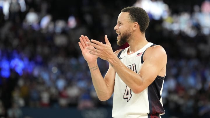 Aug 8, 2024; Paris, France; United States shooting guard Stephen Curry (4) celebrates after the game against Serbia in a men's basketball semifinal game during the Paris 2024 Olympic Summer Games at Accor Arena. 