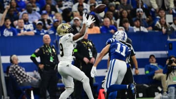 Oct 29, 2023; Indianapolis, Indiana, USA; New Orleans Saints cornerback Paulson Adebo (29) intercepts a ball meant for Indianapolis Colts wide receiver Michael Pittman Jr. (11) during the second half at Lucas Oil Stadium. Mandatory Credit: Marc Lebryk-USA TODAY Sports