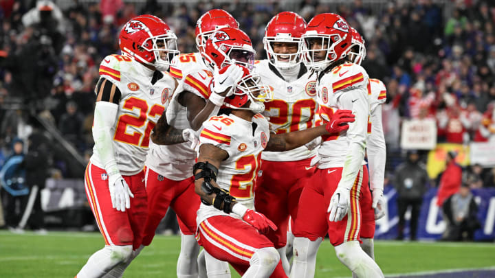 Jan 28, 2024; Baltimore, Maryland, USA; Kansas City Chiefs safety Deon Bush (26) celebrates with teammates after intercepting a pass in the end zone in the second half against the Baltimore Ravens in the AFC Championship football game at M&T Bank Stadium. Mandatory Credit: Tommy Gilligan-USA TODAY Sports