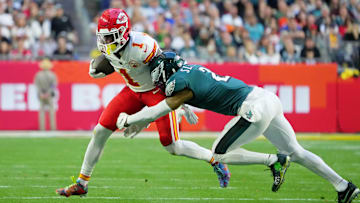 Feb 12, 2023; Glendale, Arizona, US; Kansas City Chiefs running back Jerick McKinnon (1) runs with the ball against Philadelphia Eagles cornerback Darius Slay (2) during the second quarter of Super Bowl LVII at State Farm Stadium. Mandatory Credit: Kirby Lee-Imagn Images