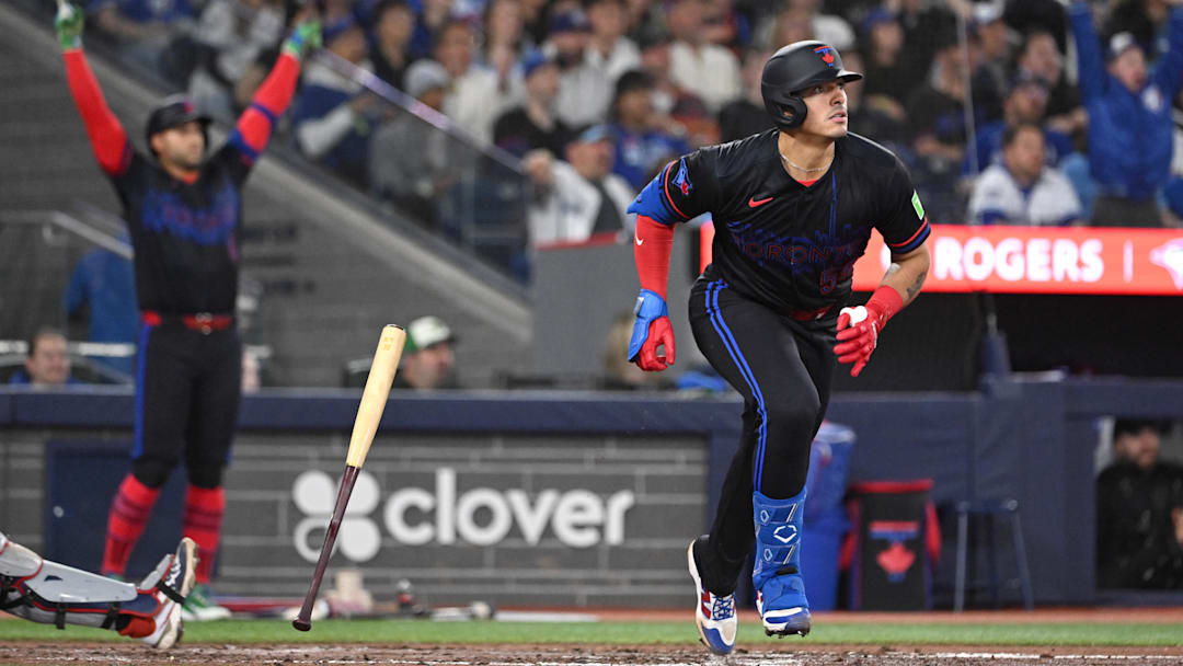 Apr 10, 2026; Toronto, Ontario, CAN;  Toronto Blue Jays catcher Brandon Valenzuela (59) hits a two-run home run as designated hitter George Springer (4) reacts against the Minnesota Twins in the fourth inning at Rogers Centre. Mandatory Credit: Dan Hamilton-Imagn Images