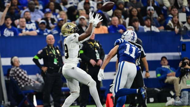 New Orleans Saints cornerback Paulson Adebo (29) intercepts a pass to Indianapolis Colts wide receiver Michael Pittman Jr.