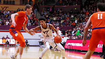 Jan 25, 2025; Blacksburg, Virginia, USA; Virginia Tech Hokies guard Rodney Brown Jr. (4) shoots the ball against Clemson Tigers center Viktor Lakhin (0) during the first half at Cassell Coliseum. Mandatory Credit: Peter Casey-Imagn Images