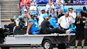 Oct 26, 2025; Charlotte, North Carolina, USA; Carolina Panthers guard Brady Christensen (70) leaves the field on a cart in the fourth quarter against the Buffalo Bills at Bank of America Stadium. Mandatory Credit: Bob Donnan-Imagn Images