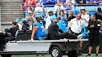 Oct 26, 2025; Charlotte, North Carolina, USA; Carolina Panthers guard Brady Christensen (70) leaves the field on a cart in the fourth quarter against the Buffalo Bills at Bank of America Stadium. Mandatory Credit: Bob Donnan-Imagn Images
