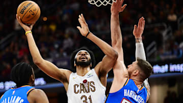 Jan 8, 2025; Cleveland, Ohio, USA; Cleveland Cavaliers center Jarrett Allen (31) drives to the basket against Oklahoma City Thunder center Isaiah Hartenstein (55) during the second half at Rocket Mortgage FieldHouse. Mandatory Credit: Ken Blaze-Imagn Images