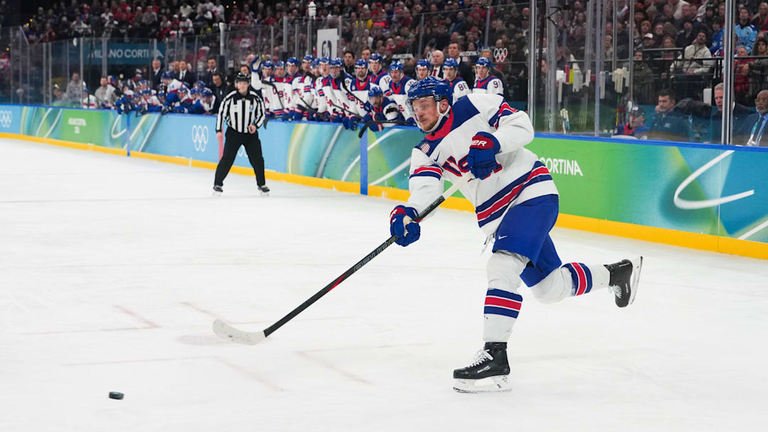 Feb 20, 2026; Milan, Italy; Jack Hughes (86) of the United States takes a shot on goal during the second period against Slovakia in a men's ice hockey semifinal during the Milano Cortina 2026 Olympic Winter Games at Milano Santagiulia Ice Hockey Arena. Mandatory Credit: James Lang-Imagn Images
