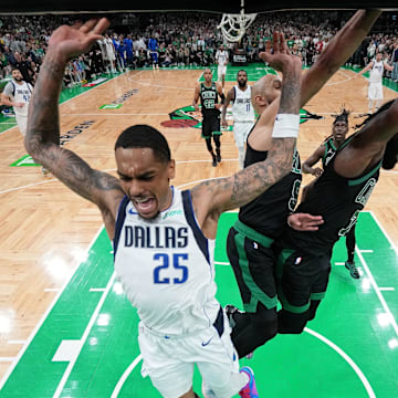 Jun 9, 2024; Boston, Massachusetts, USA; Dallas Mavericks forward P.J. Washington (25) reacts after losing control of the ball against Boston Celtics guard Derrick White (9) and guard Jaylen Brown (7) during the fourth quarter in game two of the 2024 NBA Finals at TD Garden. Mandatory Credit: Peter Casey-Imagn Images