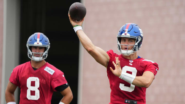 Jul 25, 2024; East Rutherford, NY, USA; New York Giants quarterback Daniel Jones (8) watches as quarterback Nathan Rourke (3) throws a pass during training camp at Quest Diagnostics Training Center. Mandatory Credit: Lucas Boland-USA TODAY Sports