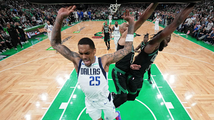 Jun 9, 2024; Boston, Massachusetts, USA; Dallas Mavericks forward P.J. Washington (25) reacts after losing control of the ball against Boston Celtics guard Derrick White (9) and guard Jaylen Brown (7) during the fourth quarter in game two of the 2024 NBA Finals at TD Garden. Mandatory Credit: Peter Casey-Imagn Images