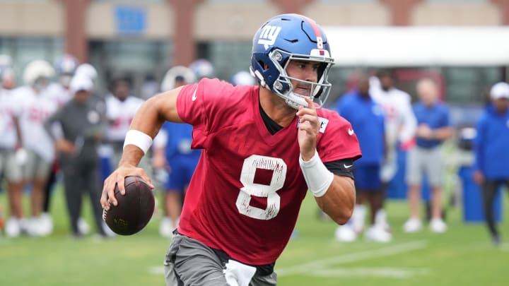 Jul 25, 2024; East Rutherford, NY, USA; New York Giants quarterback Daniel Jones (8) scrambles during training camp at Quest Diagnostics Training Center.  