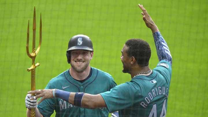 Jun 18, 2024; Cleveland, Ohio, USA; Seattle Mariners left fielder Luke Raley (20) celebrates his solo home run with center fielder Julio Rodriguez (44) in the fifth inning against the Cleveland Guardians at Progressive Field. Mandatory Credit: David Richard-USA TODAY Sports