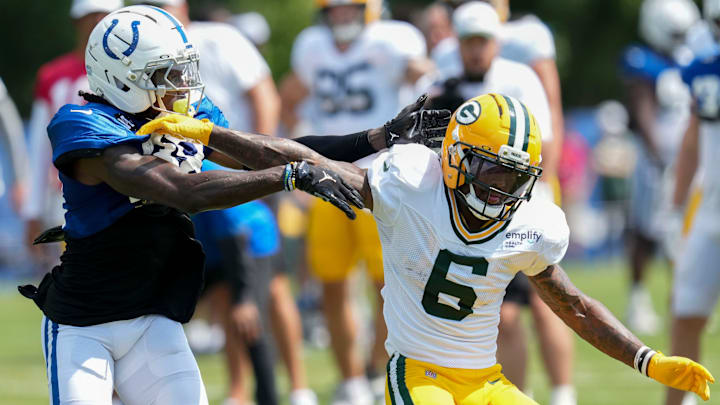 Indianapolis Colts cornerback Chris Lammons (38) attempts to bring down Green Bay Packers wide receiver Mecole Hardman (6) on Thursday, Aug. 14, 2025, at a joint practice during Indianapolis Colts’ training camp at Grand Park in Westfield.