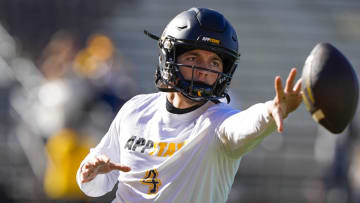 Sep 23, 2023; Laramie, Wyoming, USA; Appalachian State Mountaineers quarterback Joey Aguilar (4) warms up before game against the Wyoming Cowboys at Jonah Field at War Memorial Stadium. Mandatory Credit: Troy Babbitt-USA TODAY Sports