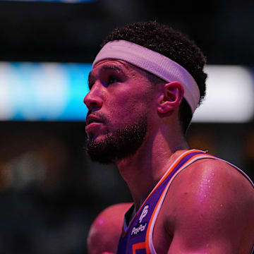 Apr 23, 2024; Minneapolis, Minnesota, USA; Phoenix Suns guard Devin Booker (1) walks back to the bench against the Minnesota Timberwolves in the second quarter during game two of the first round for the 2024 NBA playoffs at Target Center. Mandatory Credit: Brad Rempel-Imagn Images