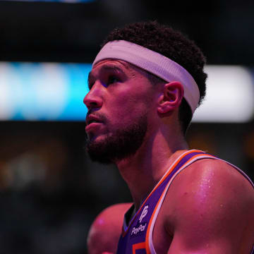Apr 23, 2024; Minneapolis, Minnesota, USA; Phoenix Suns guard Devin Booker (1) walks back to the