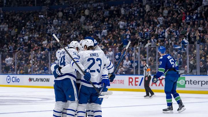 Feb 8, 2025; Vancouver, British Columbia, CAN; Toronto Maple Leafs forward Auston Matthews (34) and forward Matthew Knies (23) and defenseman Oliver Ekman-Larsson (95) celebrate after a goal by and defenseman Morgan Rielly (44) in the second period against the Vancouver Canucks at Rogers Arena. Mandatory Credit: Bob Frid-Imagn Images