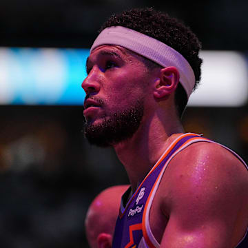 Apr 23, 2024; Minneapolis, Minnesota, USA; Phoenix Suns guard Devin Booker (1) walks back to the bench against the Minnesota Timberwolves in the second quarter during game two of the first round for the 2024 NBA playoffs at Target Center. Mandatory Credit: Brad Rempel-Imagn Images