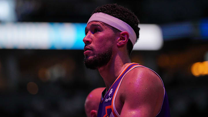 Apr 23, 2024; Minneapolis, Minnesota, USA; Phoenix Suns guard Devin Booker (1) walks back to the bench against the Minnesota Timberwolves in the second quarter during game two of the first round for the 2024 NBA playoffs at Target Center. Mandatory Credit: Brad Rempel-Imagn Images