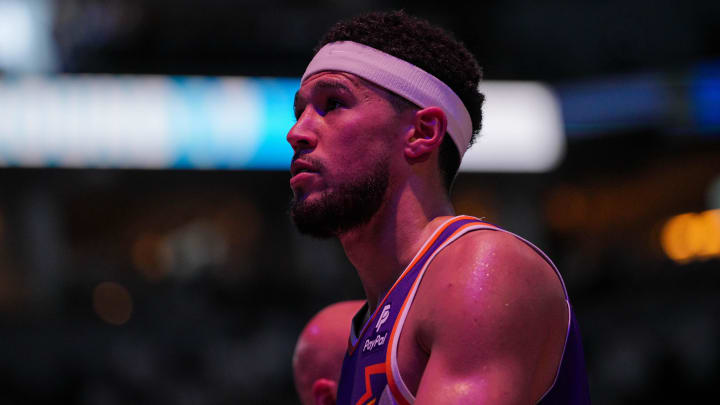 Apr 23, 2024; Minneapolis, Minnesota, USA; Phoenix Suns guard Devin Booker (1) walks back to the bench against the Minnesota Timberwolves in the second quarter during game two of the first round for the 2024 NBA playoffs at Target Center. Mandatory Credit: Brad Rempel-USA TODAY Sports