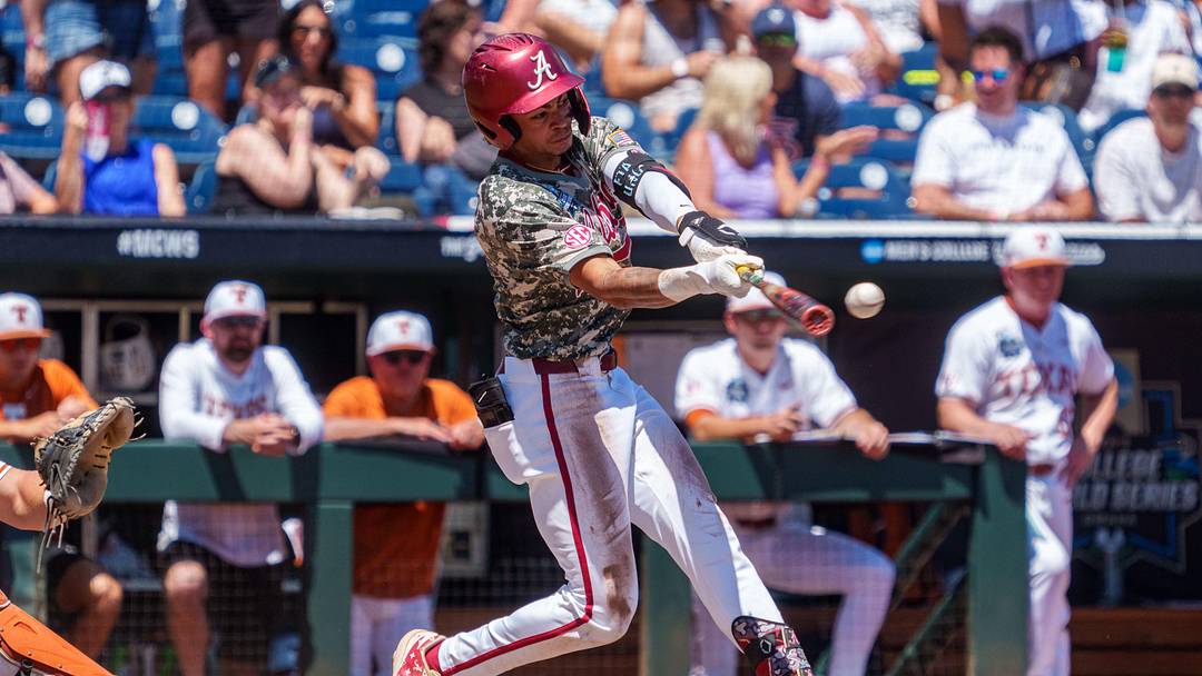 Jun 14, 2026; Omaha, NE, USA; Alabama Crimson Tide shortstop Justin Lebron (1) hits a single against the Texas Longhorns during the third inning at Charles Schwab Field. Mandatory Credit: Dylan Widger-Imagn Images