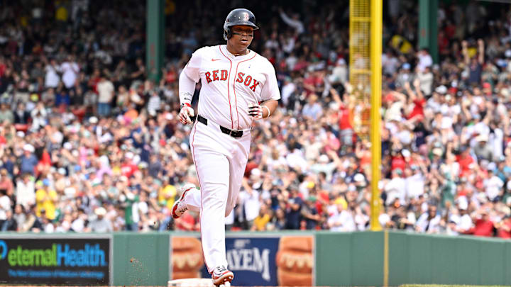 Red Sox designated hitter Rafael Devers (11) runs the bases after hitting a one run home run against the New York Yankees during the fifth inning at Fenway Park on June 15.