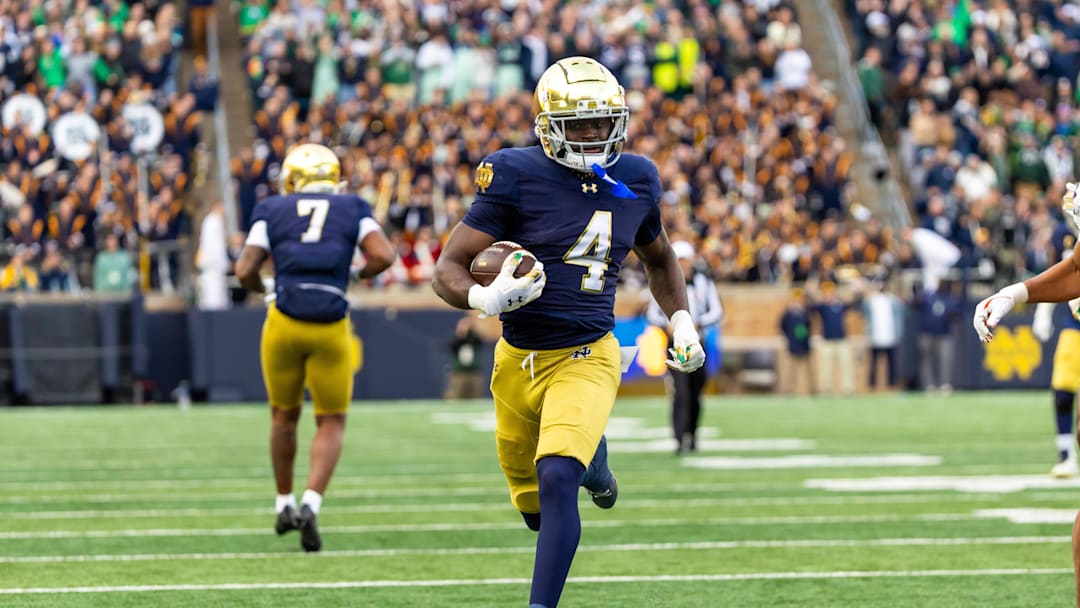 Nov 22, 2025; South Bend, Indiana, USA; Notre Dame Fighting Irish running back Jeremiyah Love (4) breaks loose for a touchdown run against the Syracuse Orange during the first half at Notre Dame Stadium. Mandatory Credit: Michael Caterina-Imagn Images