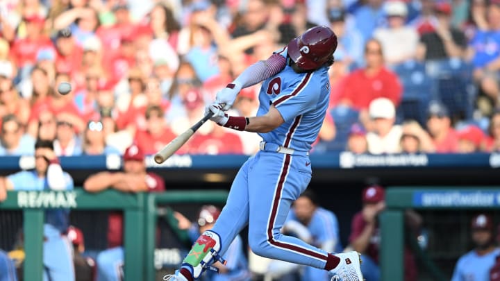 Jun 27, 2024; Philadelphia, Pennsylvania, USA; Philadelphia Phillies first baseman Bryce Harper (3) hits an RBI double against the Miami Marlins in the first inning at Citizens Bank Park.