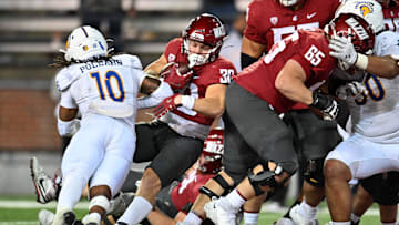Sep 20, 2024; Pullman, Washington, USA; Washington State Cougars running back Dylan Paine (30) carries the ball for a touchdown against San Jose State Spartans linebacker Jordan Pollard (10) in the second at Gesa Field at Martin Stadium. Washington State Cougars won 54-52 in double overtime. Mandatory Credit: James Snook-Imagn Images